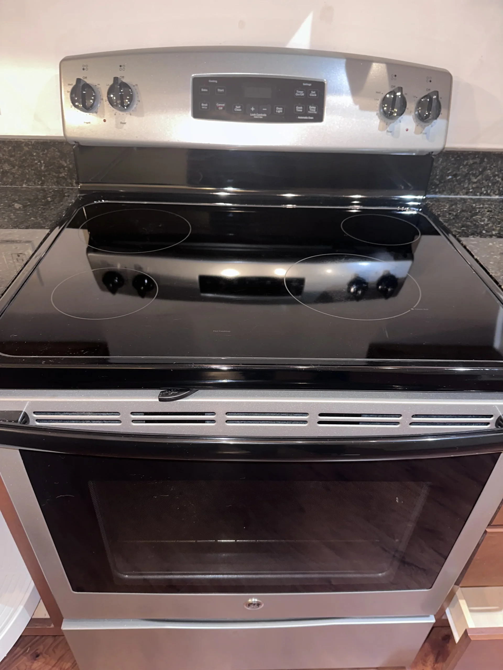 After: the same style cooktop polished clean and ready for a new resident
